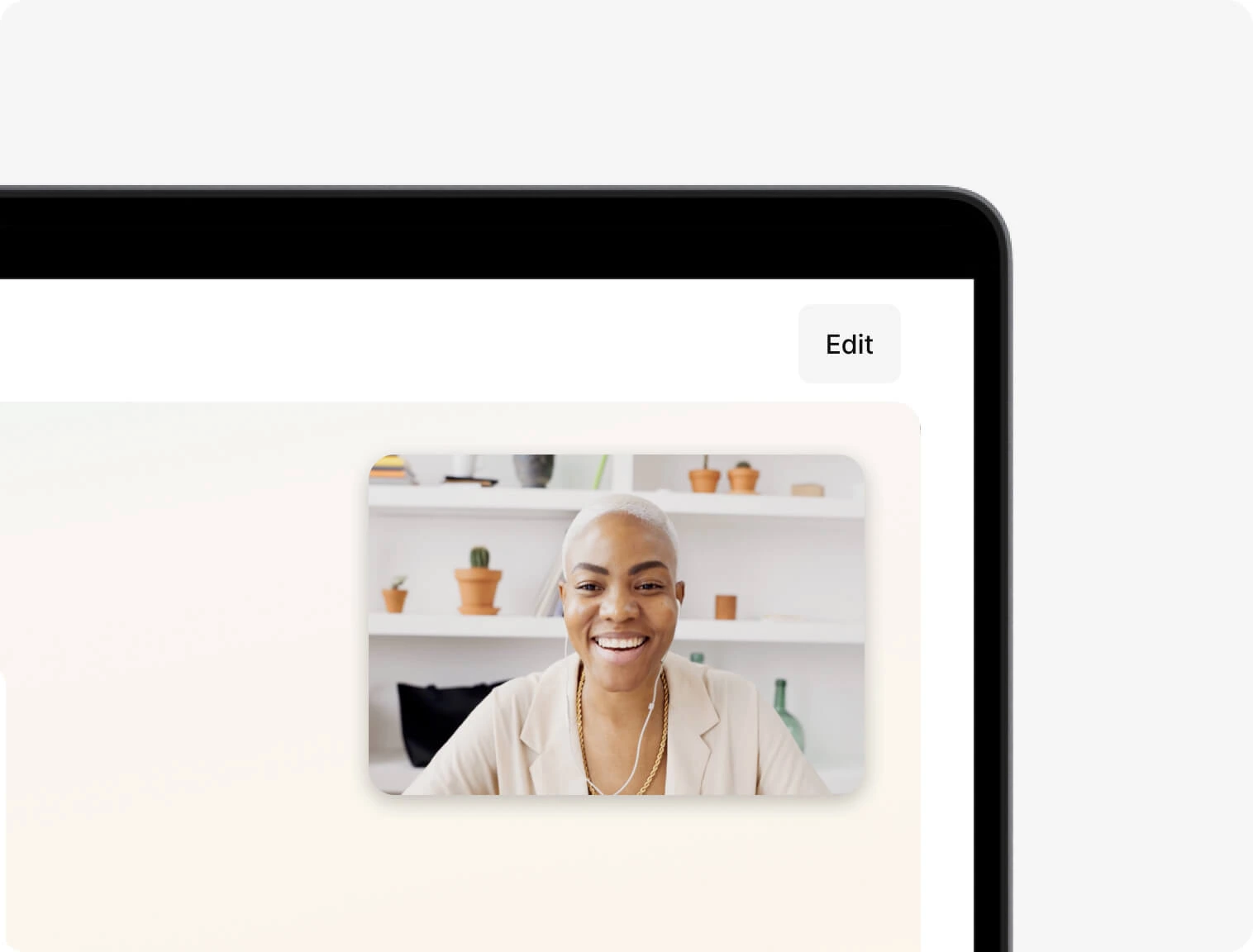 Support staff smilling in a video call in a Macbook laptop